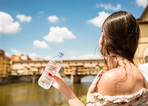 A woman holding a water bottle